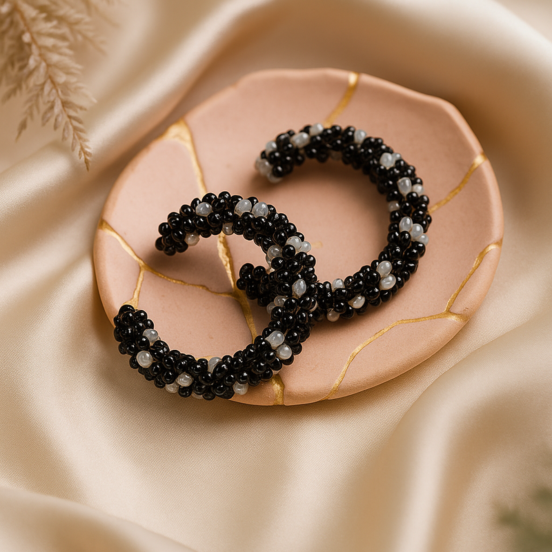 Black and Silver-Toned Beaded Hoop Earrings.