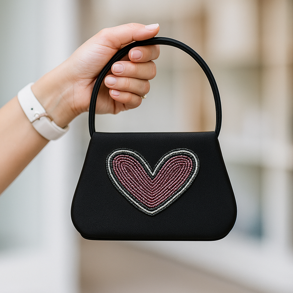 Black handbag with a beaded heart design